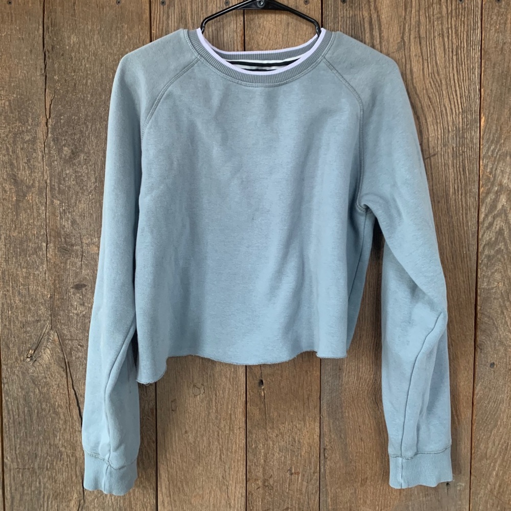 Light blue, cropped sweatshirt.